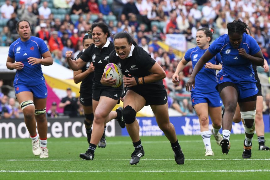 New Zealand's Ruahei Demant runs to score a try during the Women's Rugby World Cup bronze match between New Zealand and France.
