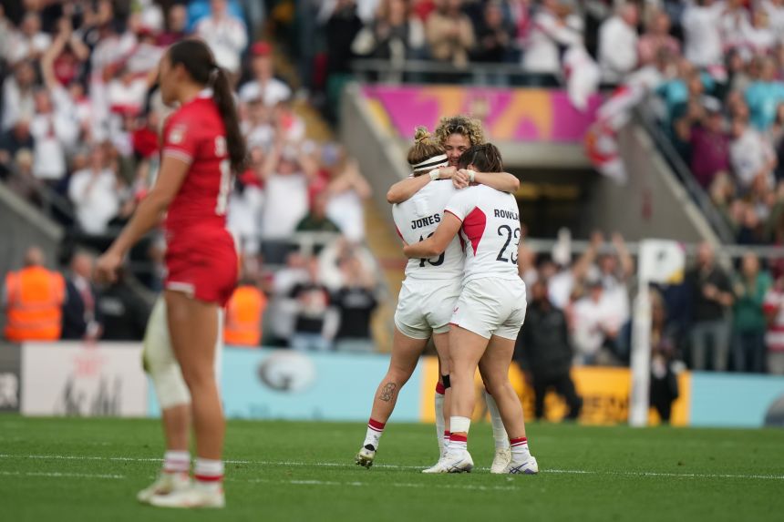 England's players celebrate after winning the Women's Rugby World Cup final match.
