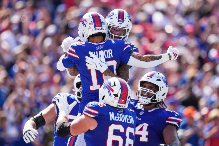 Bills players celebrate a touchdown against the Saints.