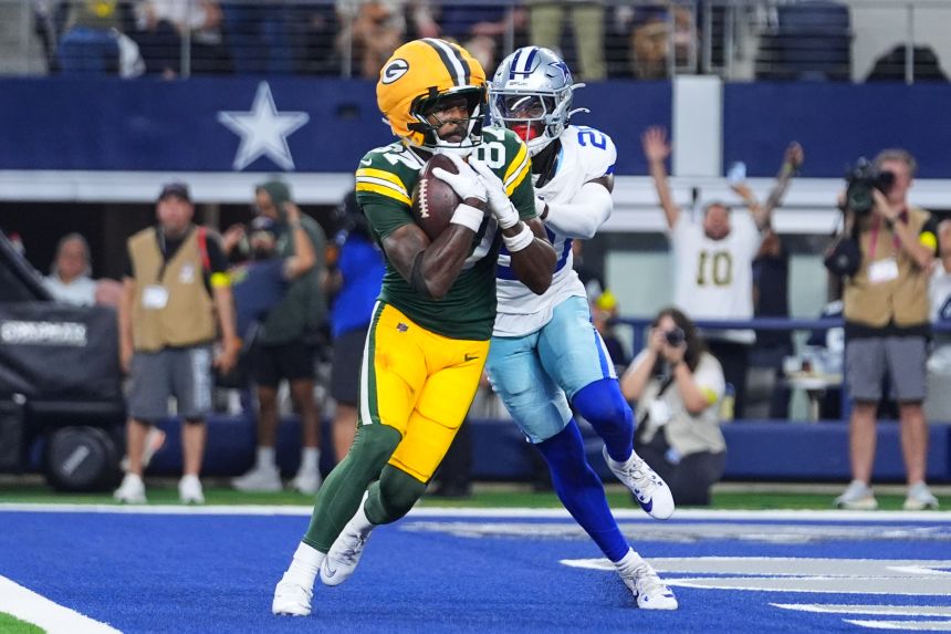 Packers wide receiver Romeo Doubs catches a touchdown pass against the Cowboys.