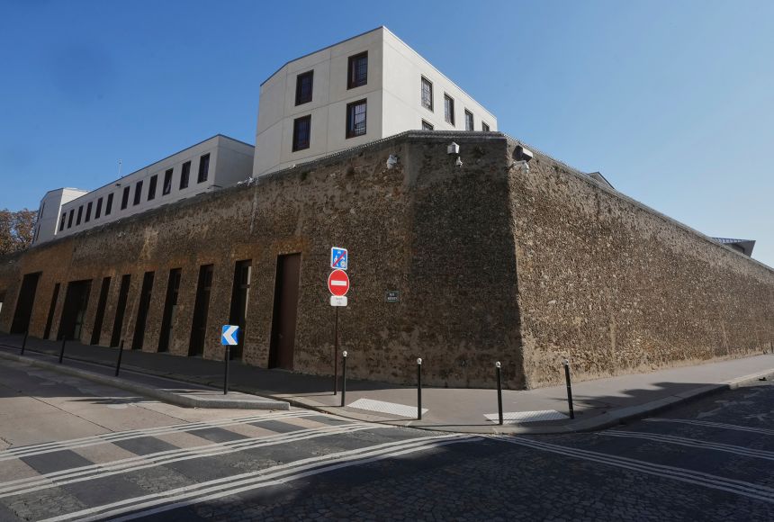 During the winter months, prisoners' faces can be seen peeking out from behind the barred windows of La Santé Prison.