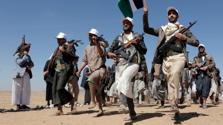 Houthi fighters march outside Sanaa, Yemen on Jan. 22, 2024.