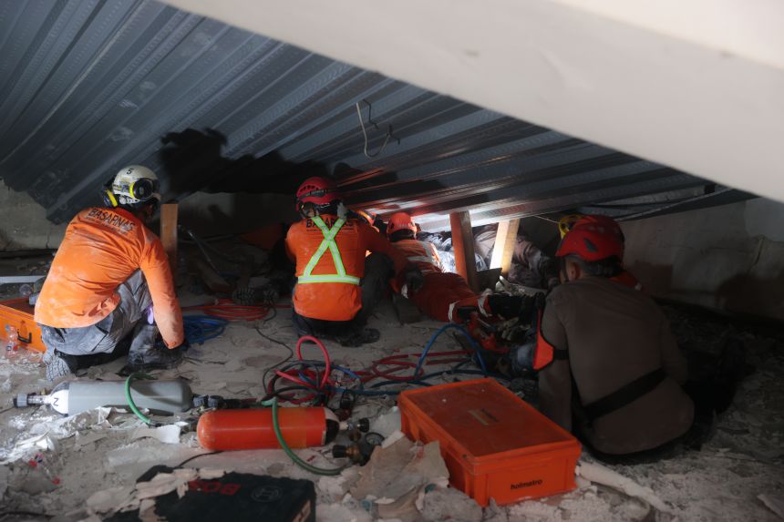 Rescuers search for survivors in the rubble on September 30, 2025.