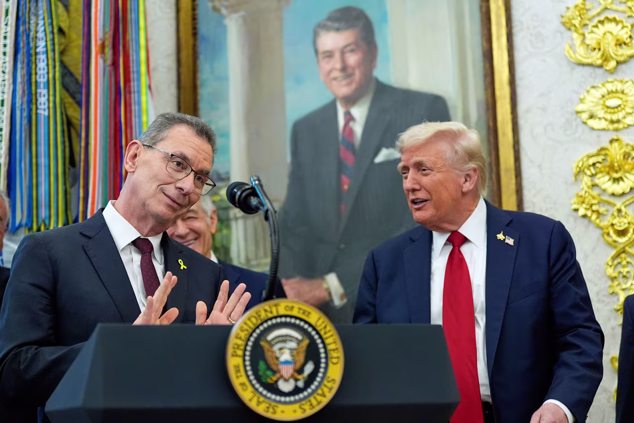 Albert Bourla, chairman and chief executive officer of the pharmaceutical company Pfizer. speaks in the Oval Office of the White House, as President Trump looks on, on Tuesday.
