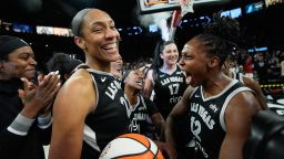 Las Vegas Aces center A'ja Wilson (22) and Las Vegas Aces guard Chelsea Gray (12) celebrate after the Las Vegas Aces defeated the Indiana Fever in Game 5 of a WNBA basketball playoff semifinals series Tuesday, Sept. 30, 2025, in Las Vegas. (AP Photo/John Locher)