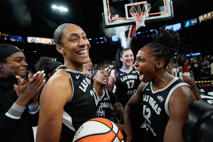 Las Vegas center A'ja Wilson (left) and guard Chelsea Gray celebrate after the Aces defeated the Indiana Fever in Game 5.