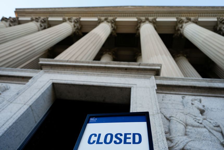 A closed sign stands in front of the National Archives on the first day of a government shutdown, Wednesday, in Washington.