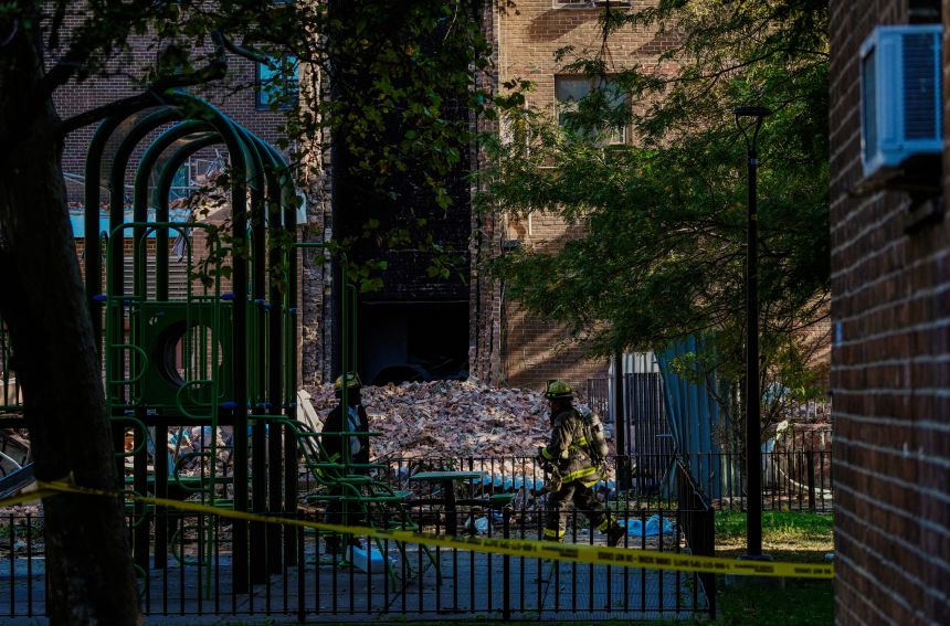 Firefighters work near the site of a partial building collapse in the Bronx borough of New York City on Wednesday.