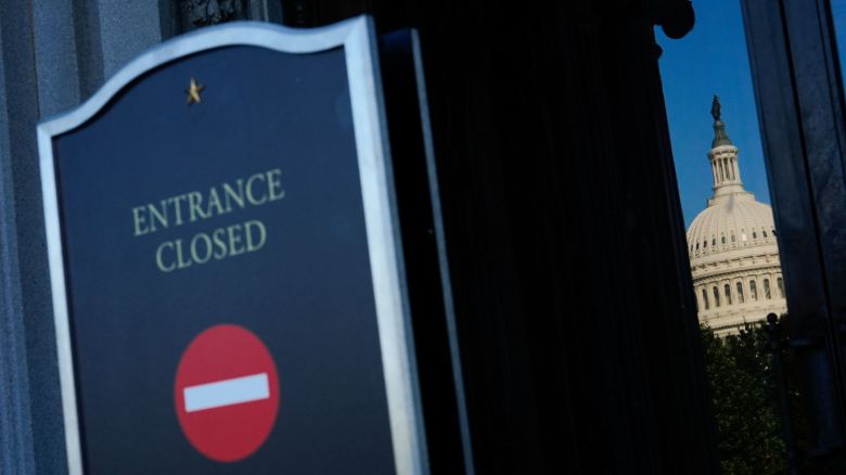 The U.S. Capitol is reflected in the doors of the Library of Congress, which is closed due to a partial government shutdown, Wednesday, Oct. 1, 2025, in Washington. (AP Photo/Julia Demaree Nikhinson)