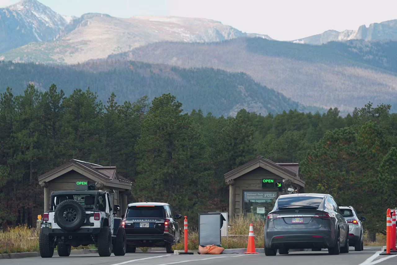Visitors filter through the two open portals to enter Rocky Mountain National Park on Wednesday in Estes Park, Colorado.