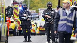 Armed police officers at the scene of an incident at Heaton Park Hebrew Congregation synagogue in Crumpsall, Manchester, where police have shot a suspect after several people were stabbed and a car was driven at members of the public. Picture date: Thursday October 2, 2025. 81846325 (Press Association via AP Images)