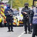 Armed police officers at the scene of an incident at Heaton Park Hebrew Congregation synagogue in Crumpsall, Manchester, where police have shot a suspect after several people were stabbed and a car was driven at members of the public. Picture date: Thursday October 2, 2025. 81846325 (Press Association via AP Images)