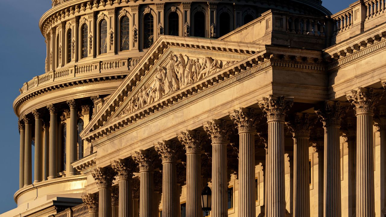 The Capitol is illuminated at sunrise to begin Day 3 of a government shutdown on October 3, 2025.