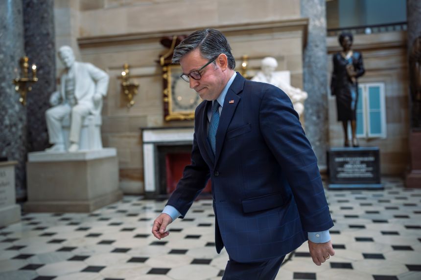 Speaker of the House Mike Johnson walks through Statuary Hall on the third day of the government shutdown, at the Capitol in Washington, DC, on Friday.