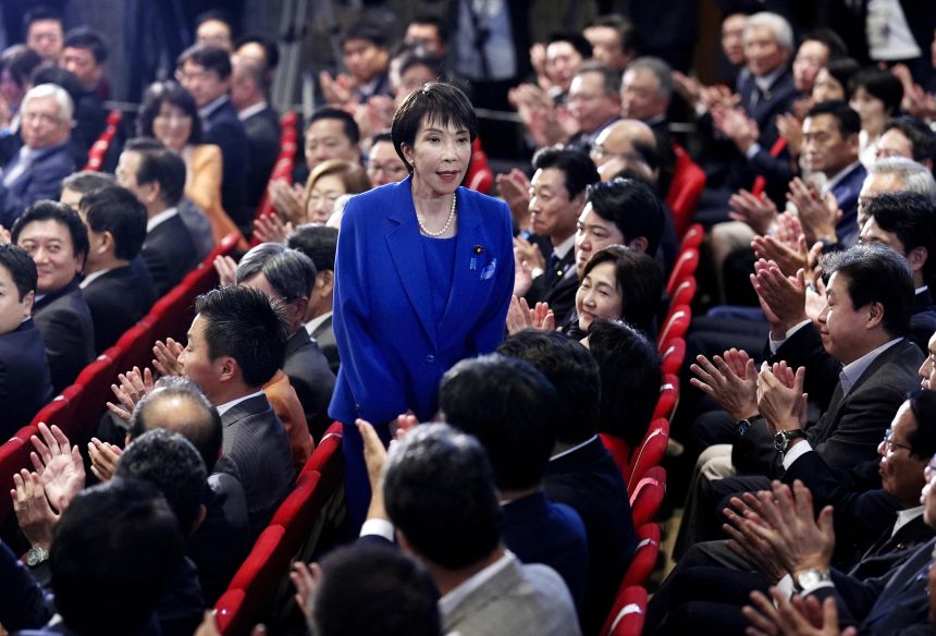 Sanae Takaichi, center, stands as she was chosen to be the new leader of Japan’s ruling Liberal Democratic Party in Tokyo on October 4, 2025.