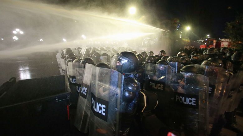 Police use a water cannon to block protesters during an opposition rally in the city center of Tbilisi, Georgia, on Saturday, October 4, 2025, boycotting the municipal elections and call for the release of political opponents.