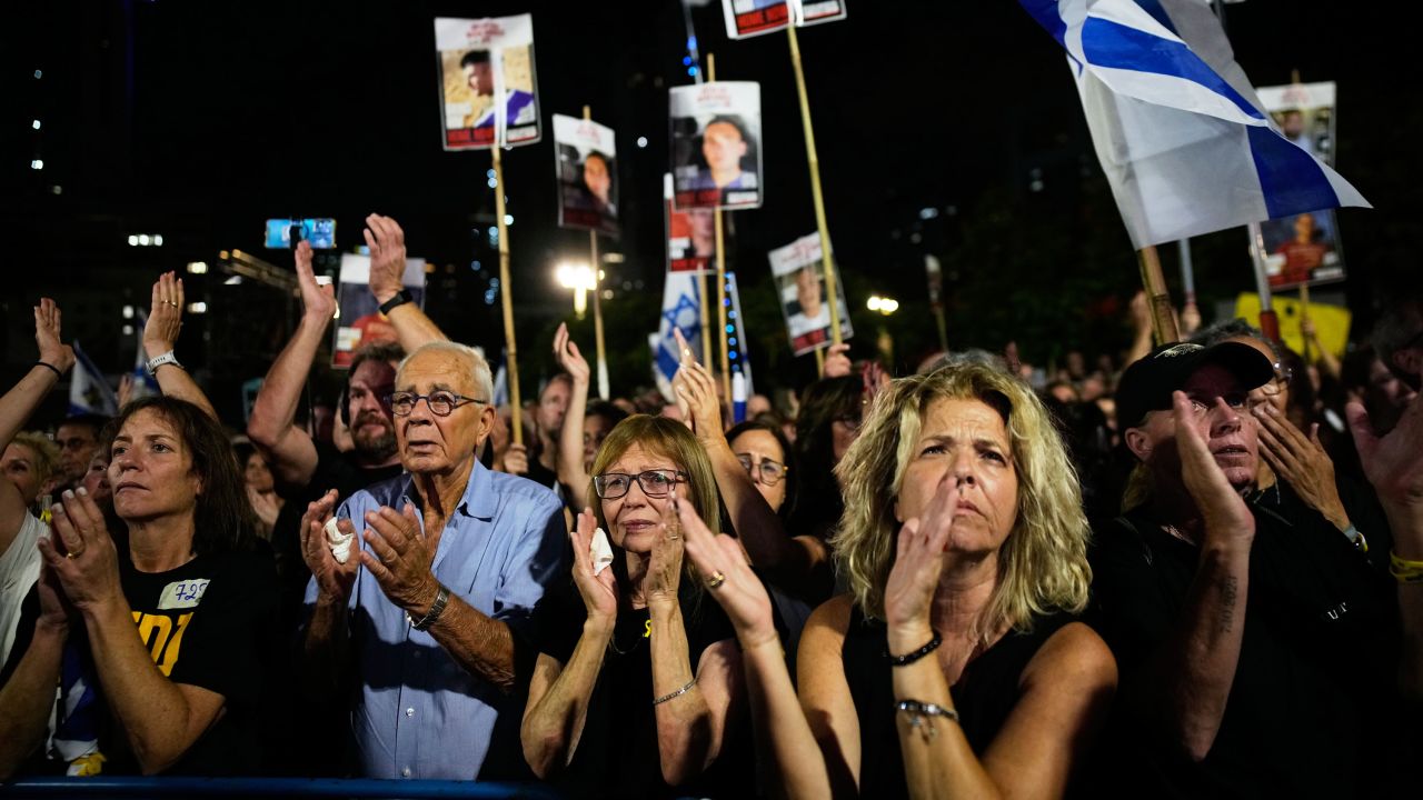 People attend a rally calling for the release of all hostages held by Hamas in the Gaza Strip and urges a ceasefire, in Tel Aviv, Israel, Saturday, Oct. 4, 2025. ahead of the second anniversary of the Israel-Hamas war. (AP Photo/Ohad Zwigenberg)