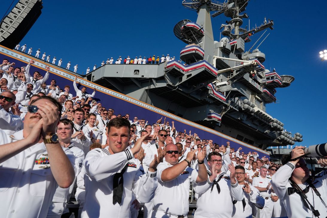 Sailors cheer as President Donald Trump speaks during a celebration for the 250th anniversary of the US Navy aboard the USS Harry S. Truman at Naval Station Norfolk in Norfolk, Virginia, on Sunday.