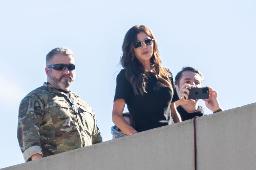 Secretary of Homeland Security Kristi Noem stands on the roof of a US Immigration and Customs Enforcement facility in Portland, Oregon, on Tuesday.