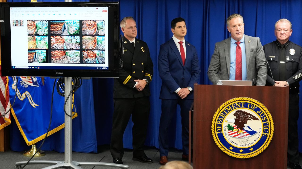 Special Agent in Charge Kenny Cooper, of the Bureau of Alcohol, Tobacco, Firearms and Explosives, Los Angeles Field Division, second from right, speaks between Acting U.S. Attorney Bill Essayli, second from left, and Los Angeles Police Chief Jim McDonnell, right, during a news conference announcing an arrest made in the Palisades Fire, Wednesday, Oct. 8, 2025, in Los Angeles.