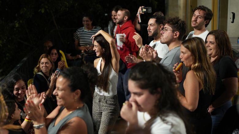 Relatives and supporters of Israeli hostages held by Hamas in the Gaza Strip celebrate after the announcement that Israel and Hamas have agreed to the first phase of a peace plan, as they gather at a plaza known as the hostages square in Tel Aviv, Israel, on October 9, 2025.