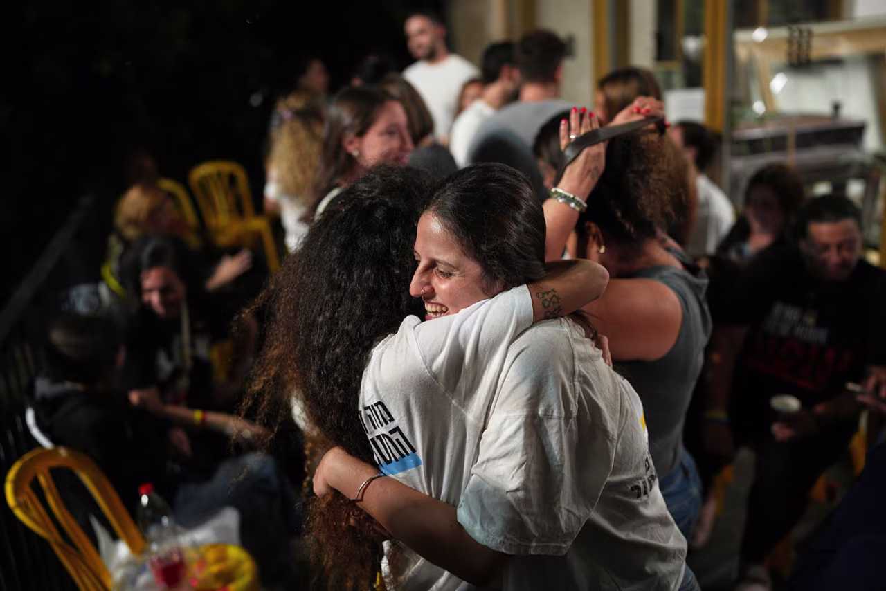 Relatives and supporters of Israeli hostages held by Hamas in the Gaza Strip celebrate after the announcement that Israel and Hamas have agreed to the first phase of a ceasefire plan, as they gather at a plaza known as the hostages square in Tel Aviv, Israel, on Thursday.