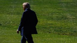 President Donald Trump walks across the South Lawn of the White House on Friday.
