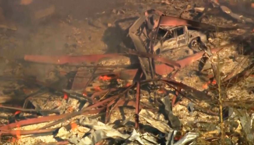 Debris covers the ground and vehicles after a powerful blast ripped through a military explosives manufacturing plant in Hickman County, Tennessee, on Friday.
