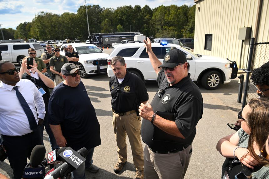 Humphreys County Sheriff Chris Davis, right, stands next to Hickman County Sheriff Jason Craft during a news conference in Bucksnort, Tennessee on Friday
