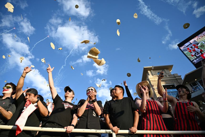 Texas Tech students throw tortillas before the game against Kansas on Saturday.