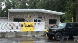 A vehicle is parked outside of Willie's Bar and Grill in St Helena Island, S.C. after a shooting occurred early Sunday, Oct. 12, 2025.