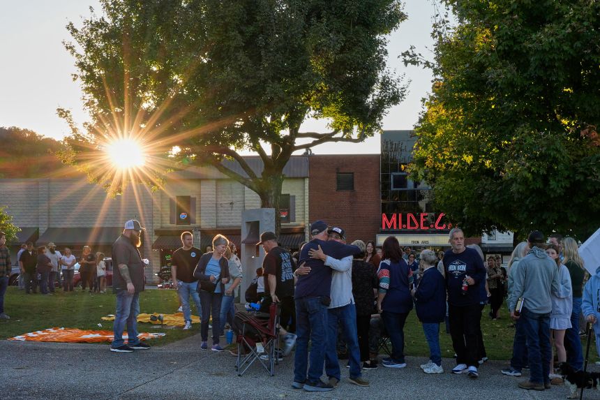 People gather at the Humphreys County Courthouse in Waverly, Tennessee, on Sunday for a candlelight vigil honoring the victims of the explosion.