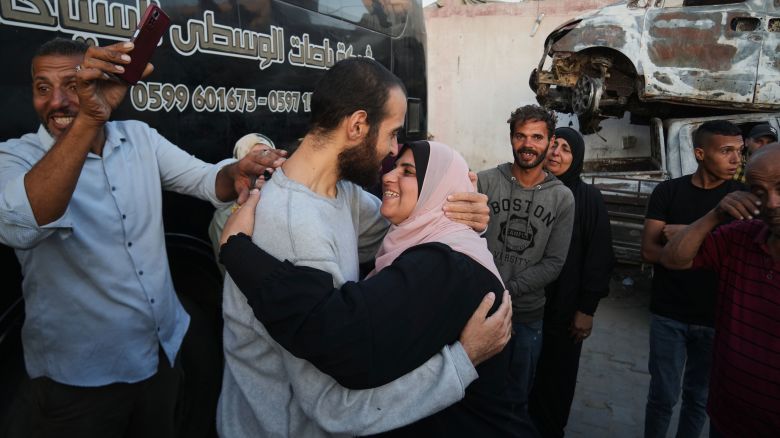People greet freed Palestinian prisoners as they arrive in the Gaza Strip after their release from Israeli jails under a ceasefire agreement between Hamas and Israel, outside Nasser Hospital in Khan Younis, southern Gaza Strip, Monday, Oct. 13, 2025. (AP Photo/Abdel Kareem Hana)