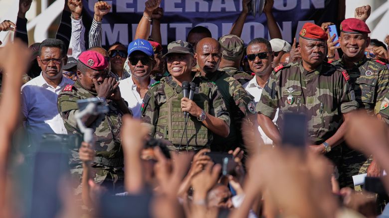 CAPSAT military unit commander Colonel Michael Randrianirina, center, announces to protesters that the armed forces are taking control of the country in Antananarivo, Madagascar, on Tuesday, October 14.