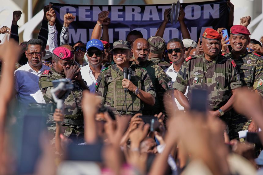 CAPSAT military unit commander Colonel Michael Randrianirina, center, announces to protesters that the armed forces are taking control of the country in Antananarivo, Madagascar, on Tuesday, October 14.