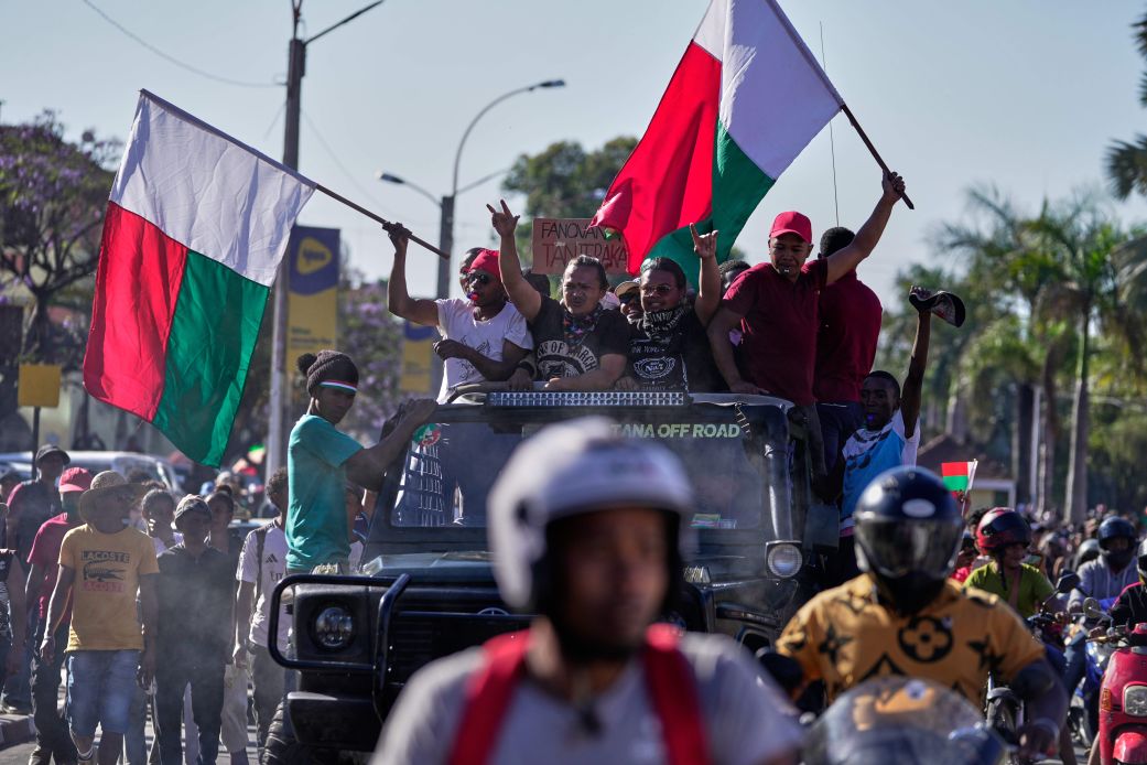 Protesters on top of a car during a protest calling for President Andry Rajoelina to step down in Antananarivo, Madagascar, on Tuesday.