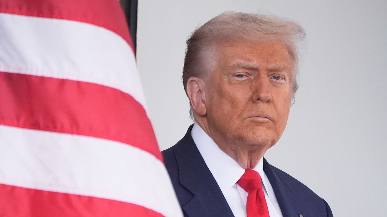 President Donald Trump waits to greet Argentina's President Javier Milei, as he arrives at the White House, Tuesday, Oct. 14, 2025, in Washington.