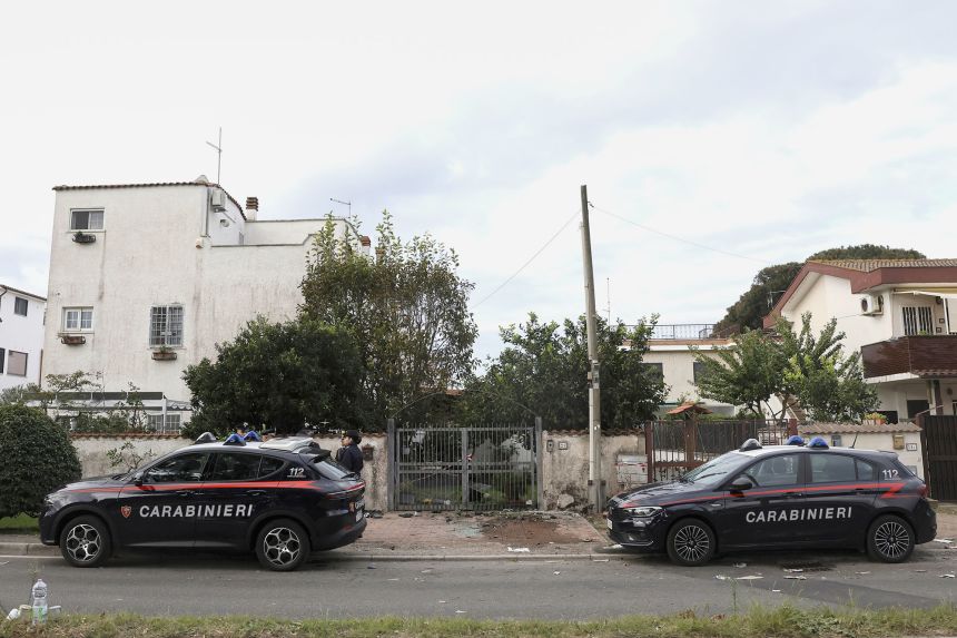 Carabinieri military police stand outside the home of investigative journalist Sigfrido Ranucci.