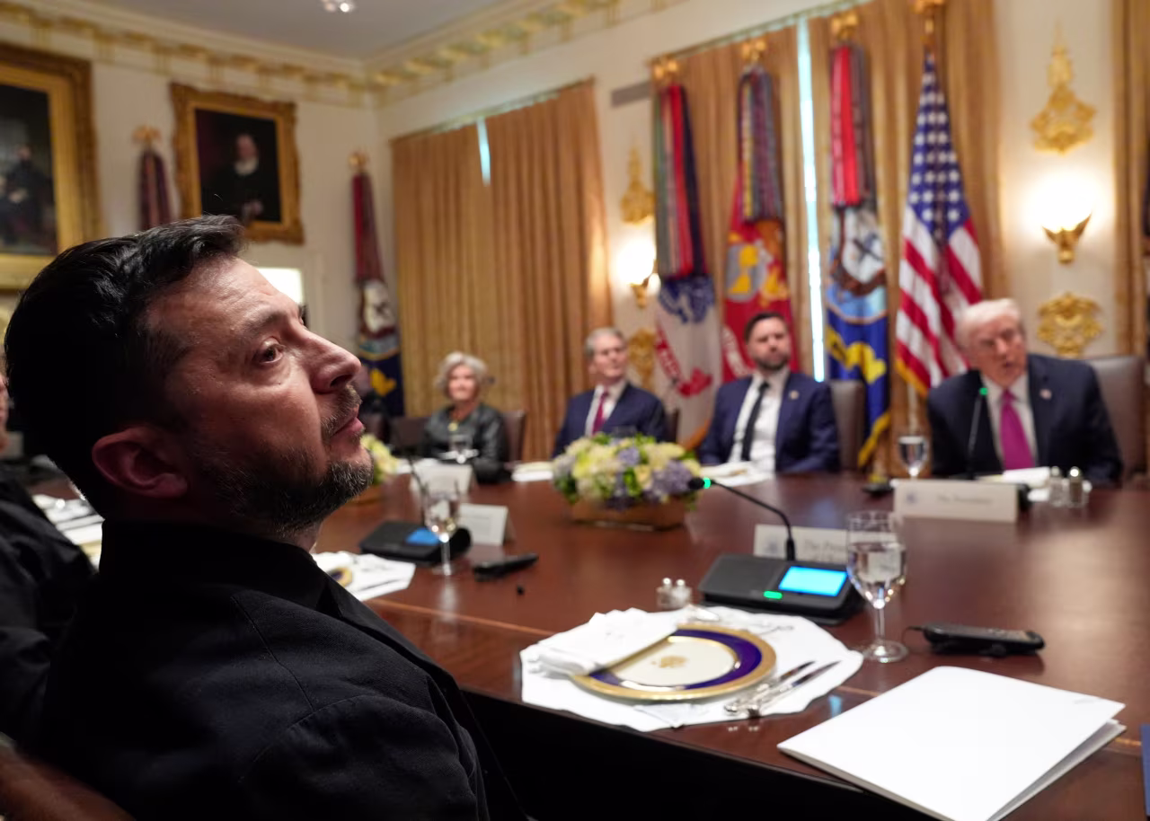 President Donald Trump, right, speaks before a lunch with Ukraine's President Volodymyr Zelenskyy, from left, as White House Chief of Staff Susie Wiles, Treasury Secretary Scott Bessent and Vice President JD Vance listen in the Cabinet Room of the White House on Friday.