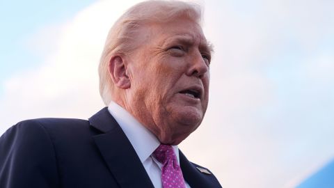 President Donald Trump speaks to reporters after arriving on Air Force One, Friday, at Palm Beach International Airport in West Palm Beach, Florida.