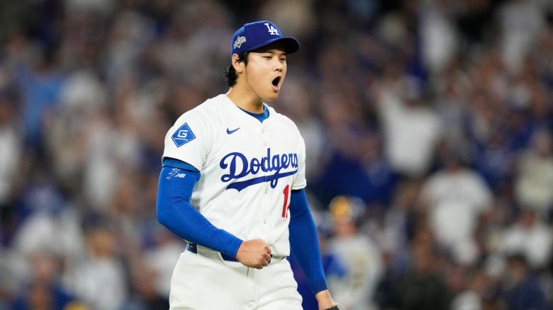 Los Angeles Dodgers pitcher Shohei Ohtani celebrates the end of the top of the third inning against the Milwaukee Brewers in Game 4 of baseball's National League Championship Series in Los Angeles on October 17, 2025.