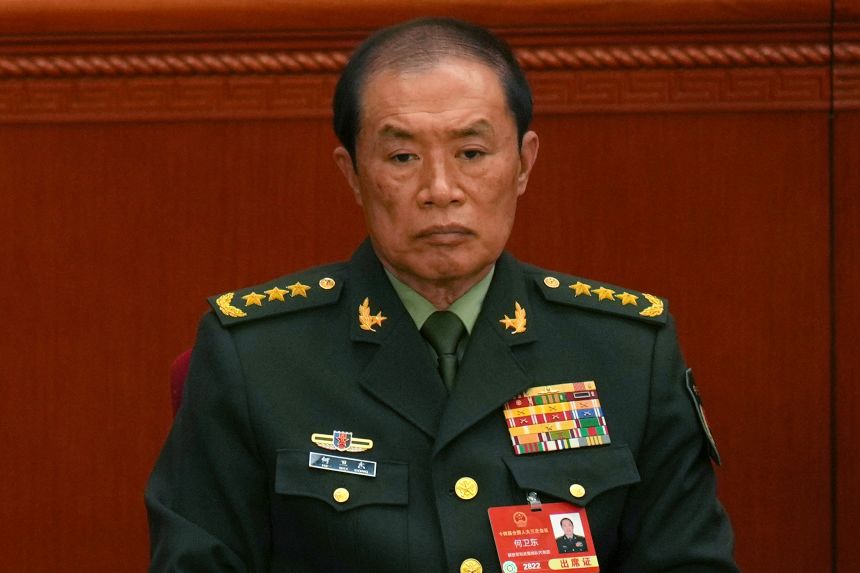 He Weidong, then vice-chair of the China's Central Military Commission attends the opening session of the National People's Congress in Beijing on March 5, 2025.
