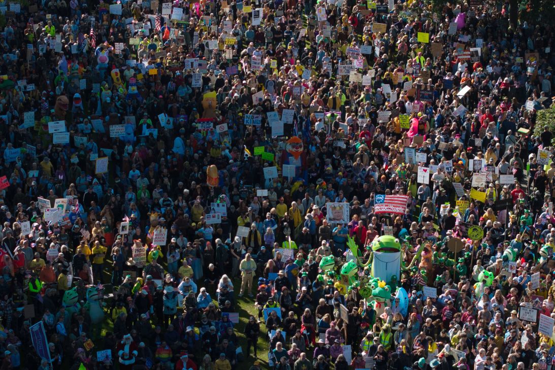 People gather along a waterfront park during a "No Kings" protest in Portland, Oregon, on Saturday.