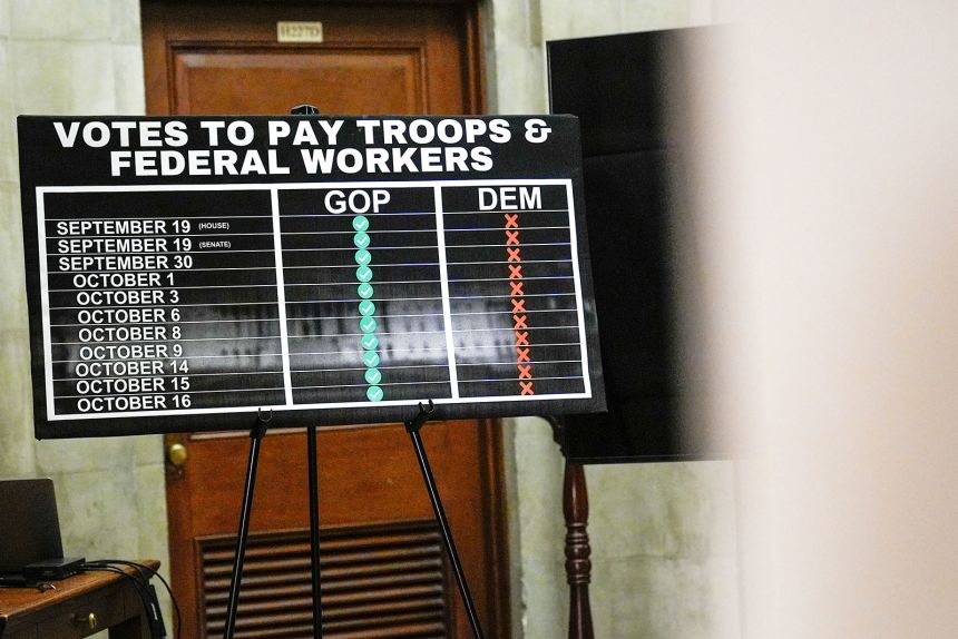 A sign faces House Speaker Mike Johnson's office on Capitol Hill, October 20, 2025, in Washington.