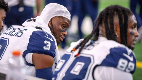 Dallas Cowboys wide receivers George Pickens, left, and Ceedee Lamb sit on the bench during a football game against the Washington Commanders on October 19, in Arlington, Texas.