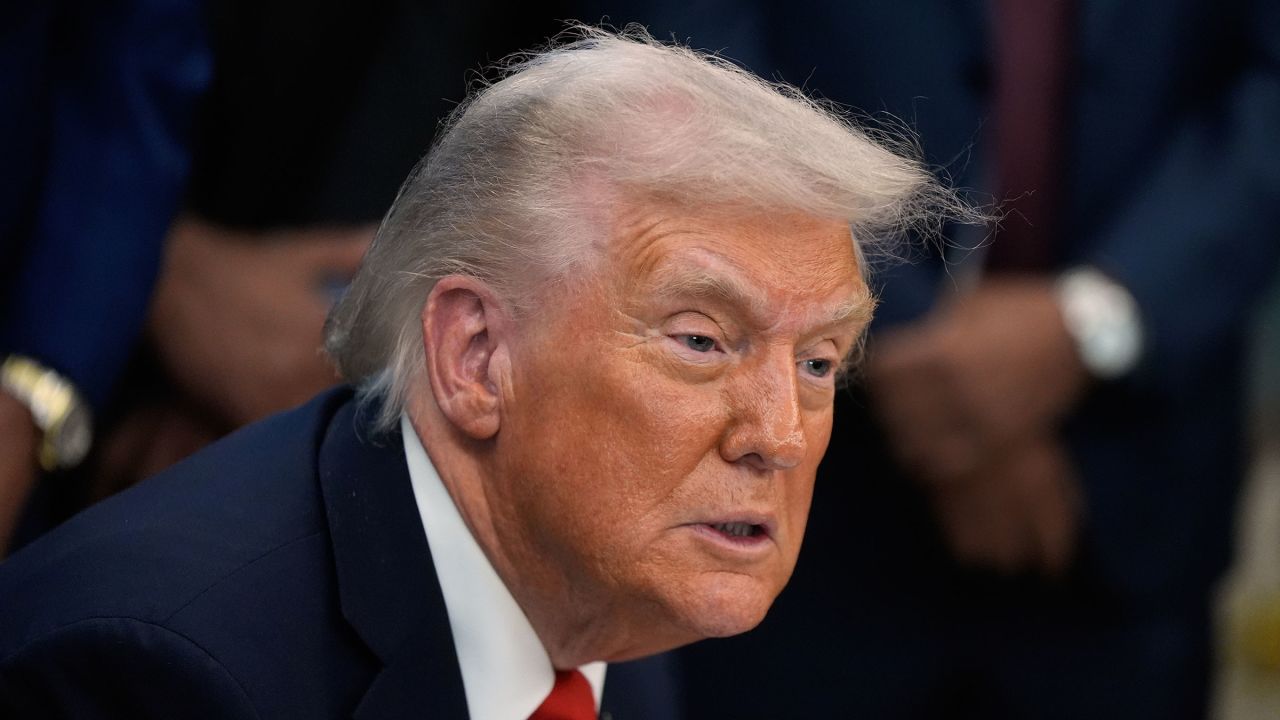 President Donald Trump answers questions from reporters in the Oval Office of the White House, on October 21, 2025.