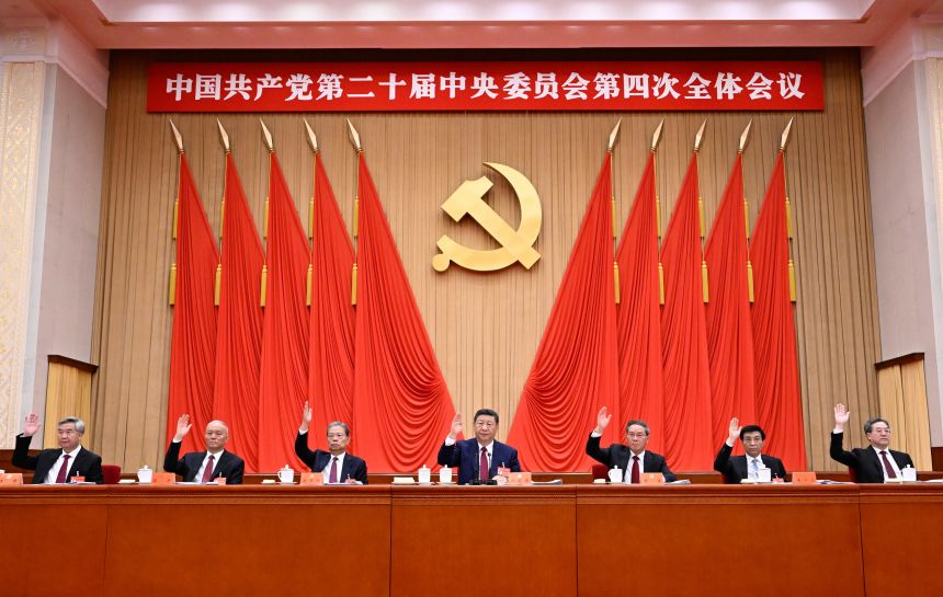 Chinese leader Xi Jinping sits alongside other members of the Politburo Standing Committee during fourth plenum on October 23.