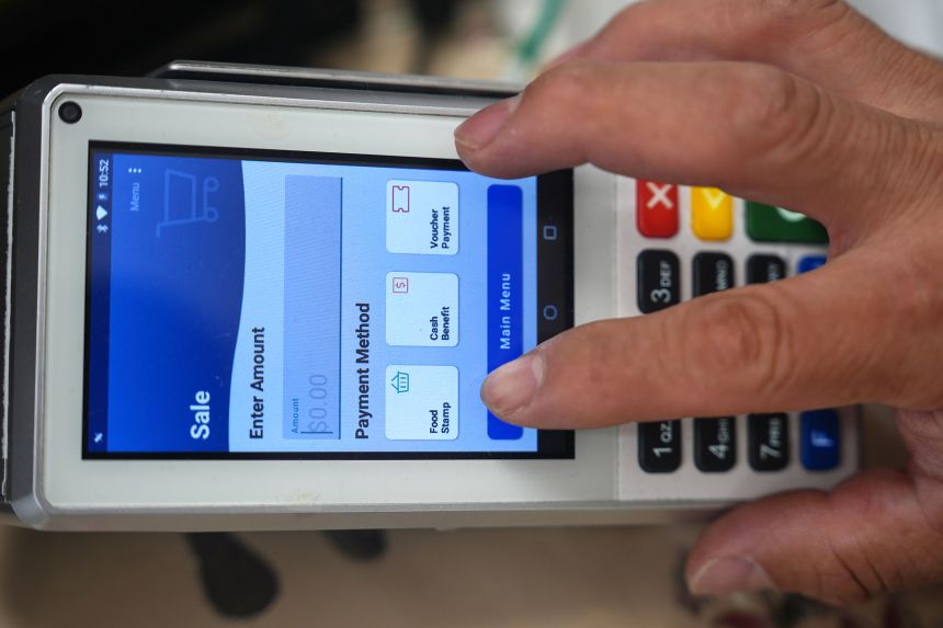 A shopper makes a purchase with food stamps in Los Angeles on October 27, 2025.