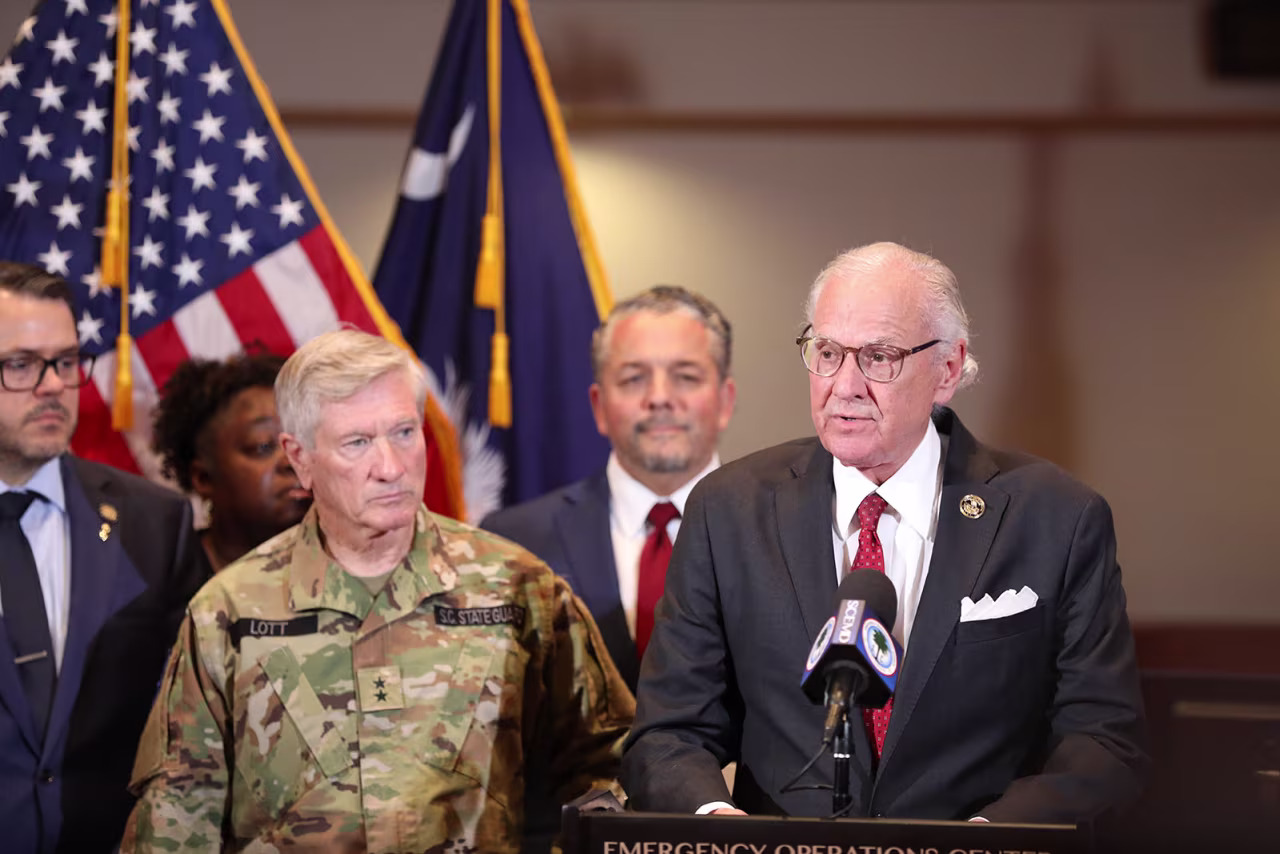 Richland County Sheriff and South Carolina State Guard Commander Leon Lott, left, and Gov. Henry McMaster, right, talk about the state's plans to deal with the suspension of SNAP benefits at a news conference on Tuesday, in West Columbia, South Carolina.