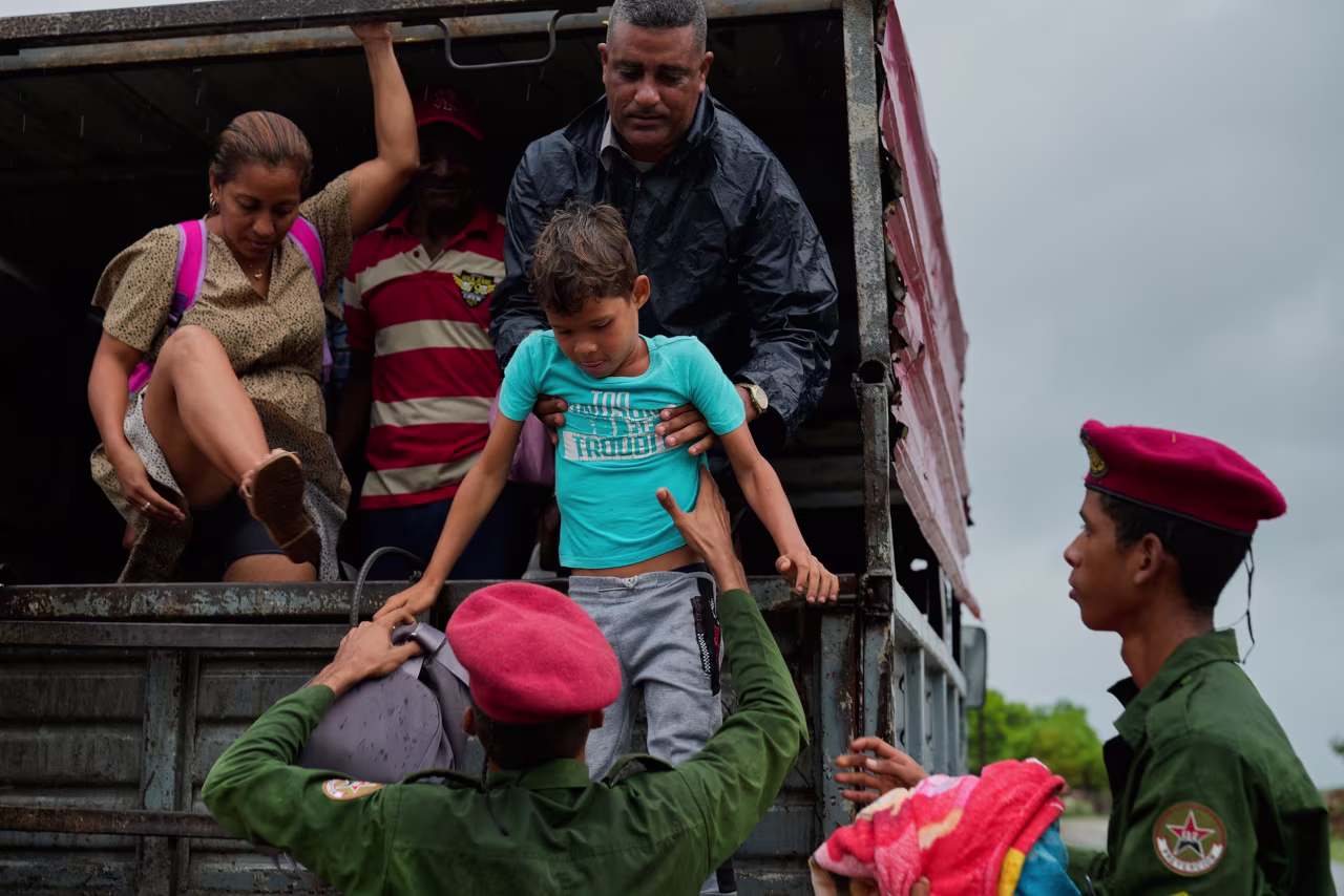 People evacuate before the arrival of Hurricane Melissa in Canizo, a community in Santiago de Cuba, on Tuesday.